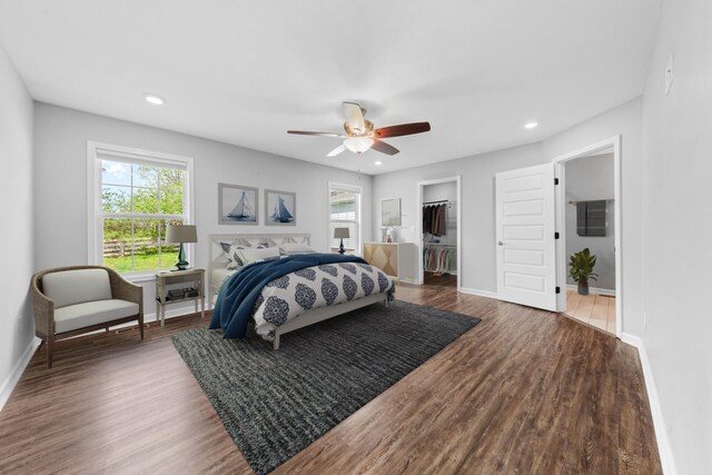 369 Springwater Dr, Summertown, TN 38483 - bedroom featuring multiple windows, wood finished floors, recessed lighting, a spacious closet, and a ceiling fan