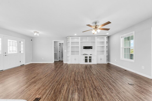 369 Springwater Dr, Summertown, TN 38483 - unfurnished living room with plenty of natural light, dark wood-style floors, a ceiling fan, and recessed lighting