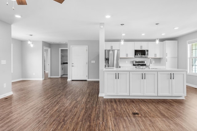 369 Springwater Dr, Summertown, TN 38483 - kitchen with appliances with stainless steel finishes, white cabinets, dark wood-style floors, light countertops, and recessed lighting