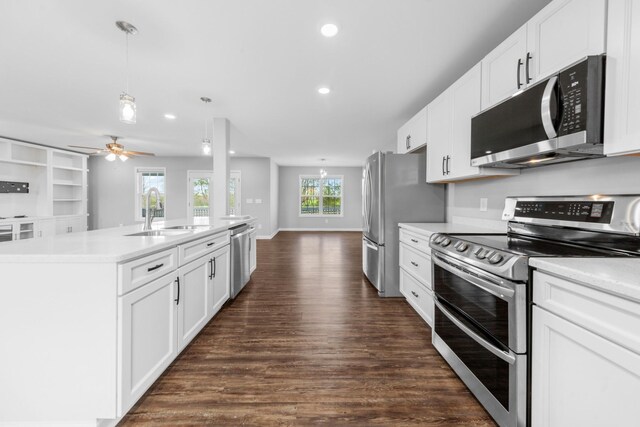 369 Springwater Dr, Summertown, TN 38483 - kitchen featuring stainless steel appliances, dark wood-style flooring, a kitchen island with sink, light countertops, and recessed lighting