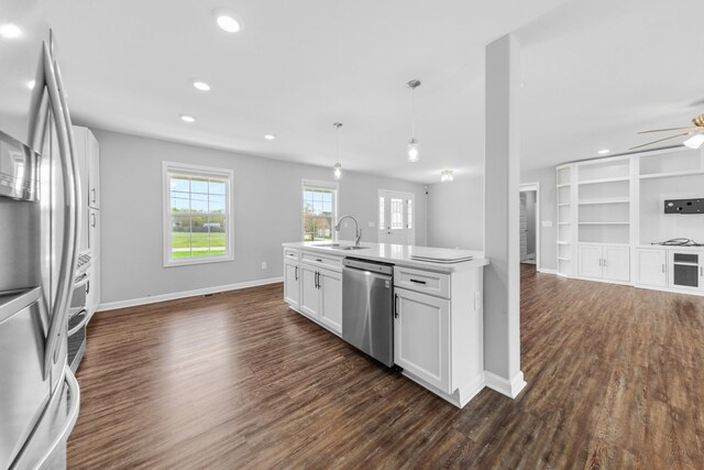 369 Springwater Dr, Summertown, TN 38483 - kitchen featuring stainless steel appliances, open floor plan, dark wood-style flooring, white cabinets, and recessed lighting