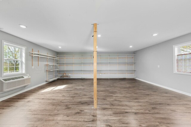 369 Springwater Dr, Summertown, TN 38483 - basement featuring a wall mounted AC, wood finished floors, and recessed lighting
