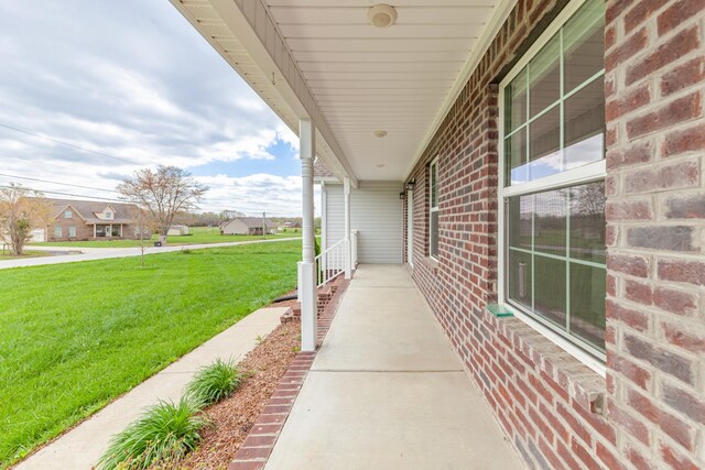 369 Springwater Dr, Summertown, TN 38483 - covered porch featuring a lawn and a residential view