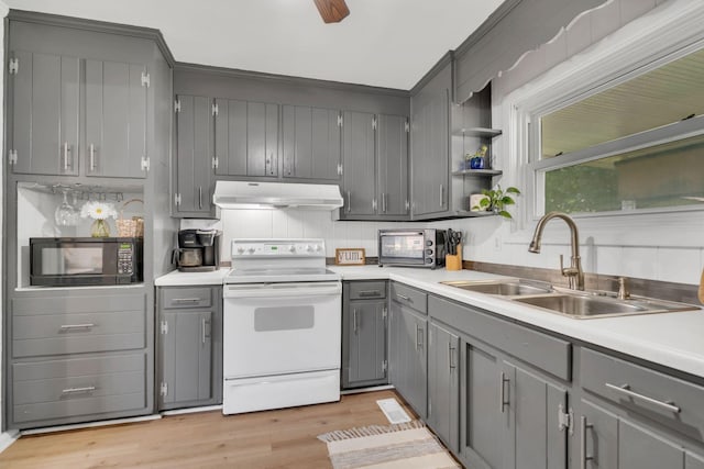 1827 Shelley St, Murfreesboro, TN 37129 - kitchen with white electric range oven, under cabinet range hood, black microwave, gray cabinetry, and light wood-style floors
