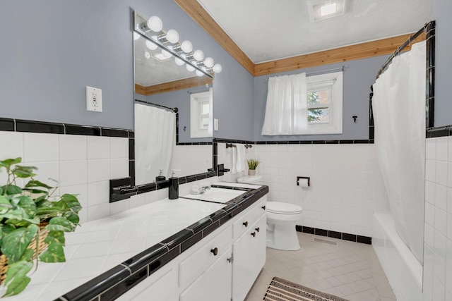 1827 Shelley St, Murfreesboro, TN 37129 - full bath with vanity, tile walls, tile patterned floors, a wainscoted wall, and shower / tub combo with curtain