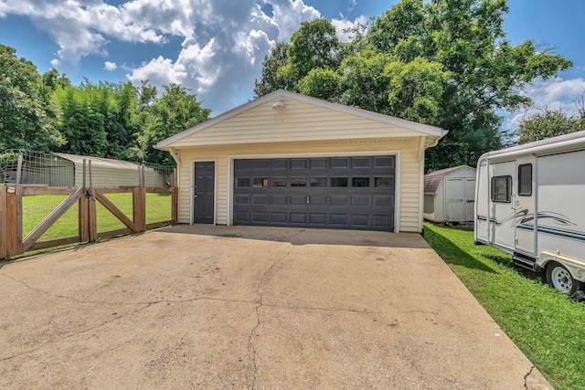 1827 Shelley St, Murfreesboro, TN 37129 - detached garage featuring a gate and a storage unit