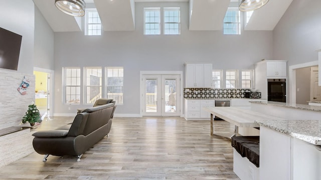 3310 Rocky Branch Rd, Watertown, TN 37184 - living area featuring a towering ceiling, light wood finished floors, and french doors