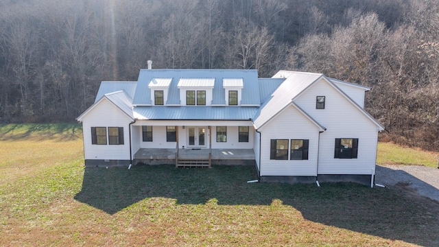 3310 Rocky Branch Rd, Watertown, TN 37184 - modern farmhouse featuring a porch, a front lawn, a view of trees, and a metal roof