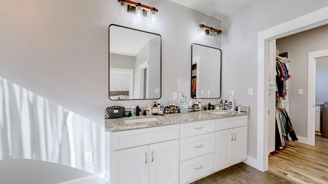 3310 Rocky Branch Rd, Watertown, TN 37184 - bathroom featuring double vanity, a spacious closet, and tile patterned flooring