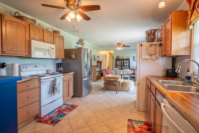 502 Budd St, Saint Joseph, TN 38481 - kitchen featuring white appliances, a ceiling fan, light tile patterned floors, ornamental molding, and brown cabinetry
