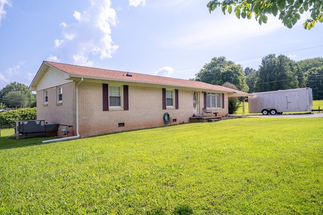 502 Budd St, Saint Joseph, TN 38481 - back of house with crawl space, brick siding, and a yard