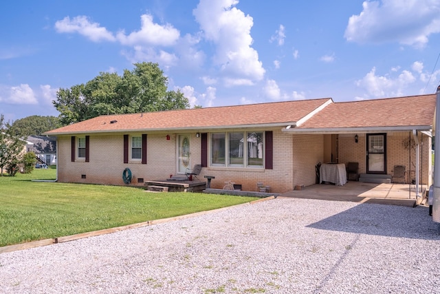 502 Budd St, Saint Joseph, TN 38481 - rear view of property featuring crawl space, driveway, a carport, a yard, and roof with shingles