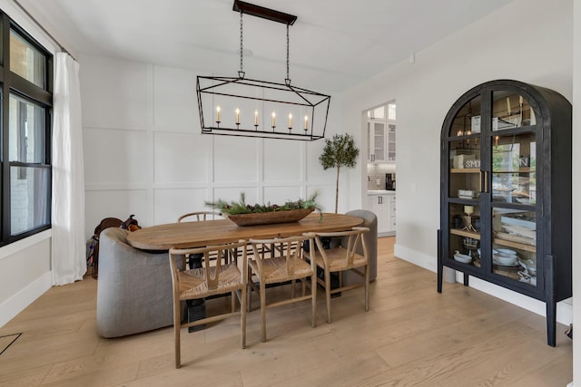 7025 Lanceleaf Dr, College Grove, TN 37046 - dining area featuring a chandelier and light wood-style flooring