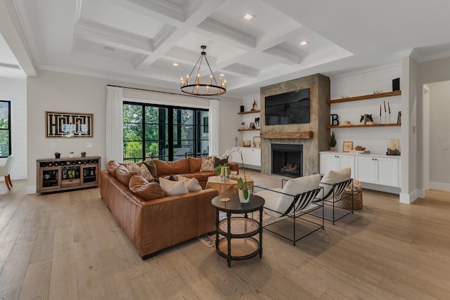 7025 Lanceleaf Dr, College Grove, TN 37046 - living area with light wood-style floors, a large fireplace, a chandelier, beam ceiling, and coffered ceiling