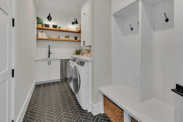 7025 Lanceleaf Dr, College Grove, TN 37046 - washroom with washing machine and dryer, cabinet space, and brick patterned floors