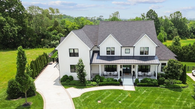 7025 Lanceleaf Dr, College Grove, TN 37046 - modern inspired farmhouse featuring roof with shingles, a standing seam roof, a porch, and a metal roof