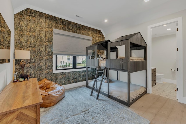7025 Lanceleaf Dr, College Grove, TN 37046 - bedroom with connected bathroom, vaulted ceiling, and recessed lighting