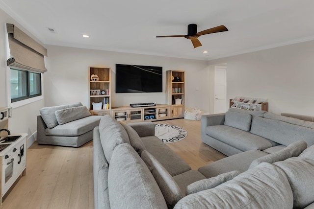 7025 Lanceleaf Dr, College Grove, TN 37046 - living room featuring a ceiling fan, light wood-type flooring, recessed lighting, and crown molding