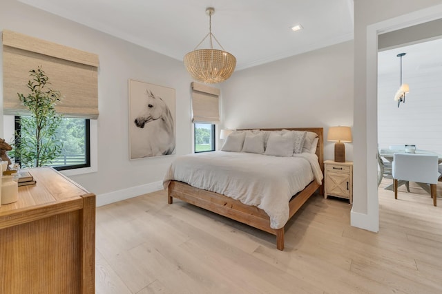 7025 Lanceleaf Dr, College Grove, TN 37046 - bedroom featuring a chandelier, light wood finished floors, and crown molding