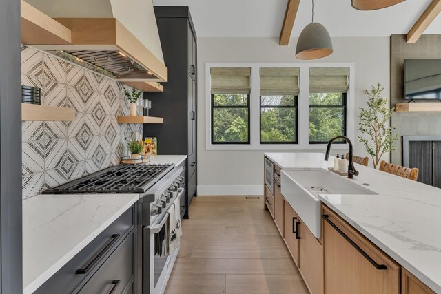 7025 Lanceleaf Dr, College Grove, TN 37046 - kitchen with appliances with stainless steel finishes, open shelves, plenty of natural light, light stone counters, and beamed ceiling