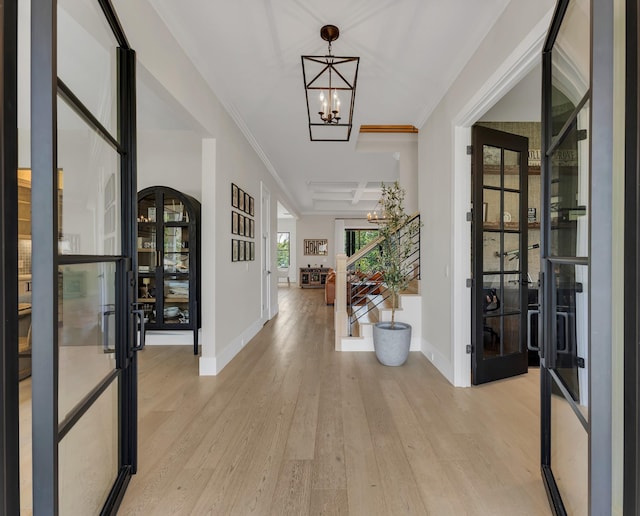 7025 Lanceleaf Dr, College Grove, TN 37046 - entryway featuring a chandelier, light wood-style flooring, french doors, and ornamental molding