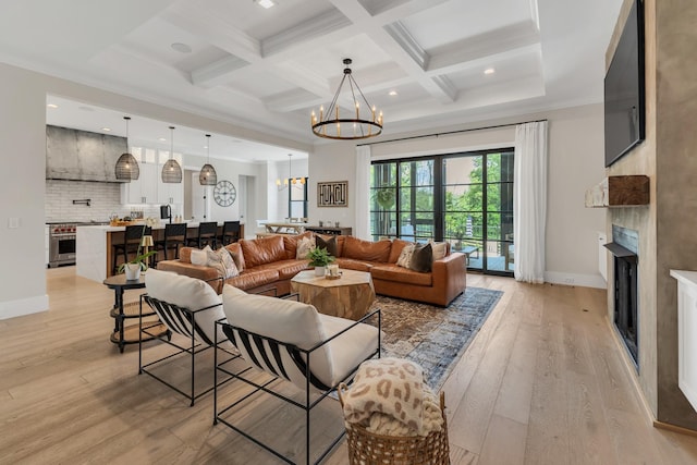 7025 Lanceleaf Dr, College Grove, TN 37046 - living area with a chandelier, a fireplace, light wood-style floors, beam ceiling, and coffered ceiling