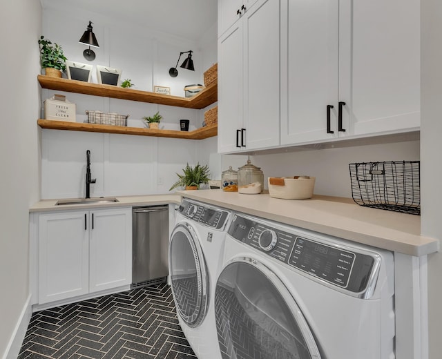 7025 Lanceleaf Dr, College Grove, TN 37046 - laundry area featuring washing machine and clothes dryer, brick patterned floors, and cabinet space
