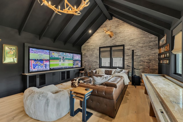 7025 Lanceleaf Dr, College Grove, TN 37046 - cinema with beam ceiling, a chandelier, wood finished floors, and high vaulted ceiling
