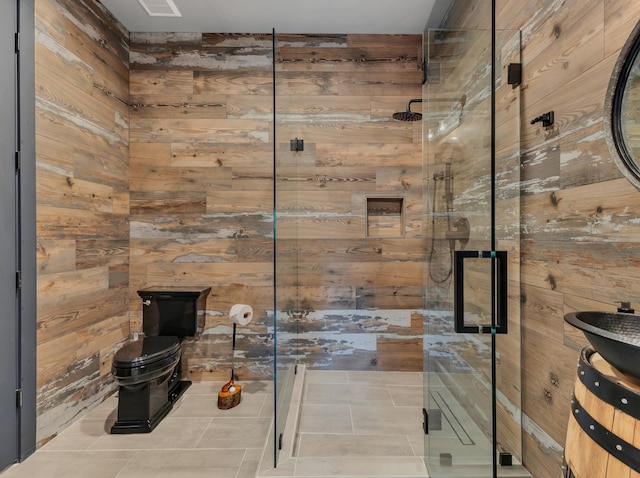 7025 Lanceleaf Dr, College Grove, TN 37046 - bathroom featuring wooden walls, a stall shower, tile patterned floors, and vanity