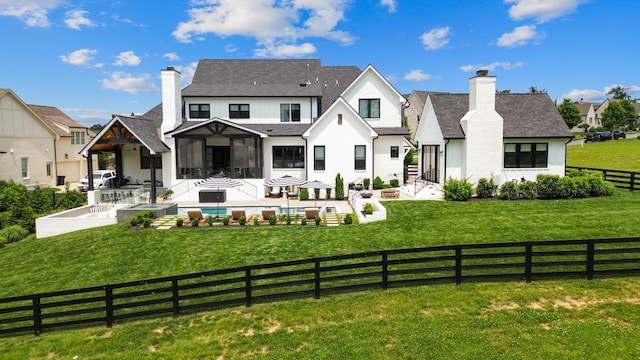 7025 Lanceleaf Dr, College Grove, TN 37046 - back of house with a fenced backyard, a patio, and a chimney