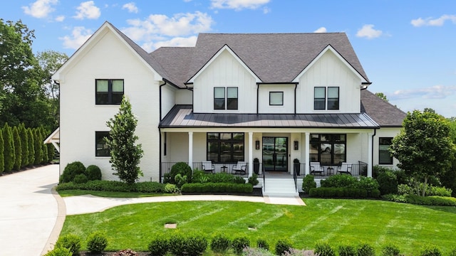 7025 Lanceleaf Dr, College Grove, TN 37046 - modern farmhouse style home featuring roof with shingles, a standing seam roof, a porch, and a front yard