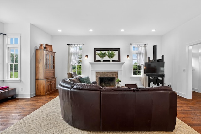 123 Jones Rd, Taft, TN 38488 - living room with a brick fireplace, wood finished floors, and recessed lighting
