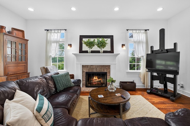 123 Jones Rd, Taft, TN 38488 - living room with plenty of natural light, wood finished floors, recessed lighting, and a brick fireplace