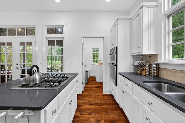 123 Jones Rd, Taft, TN 38488 - kitchen with stainless steel appliances, dark countertops, dark wood-style floors, recessed lighting, and backsplash