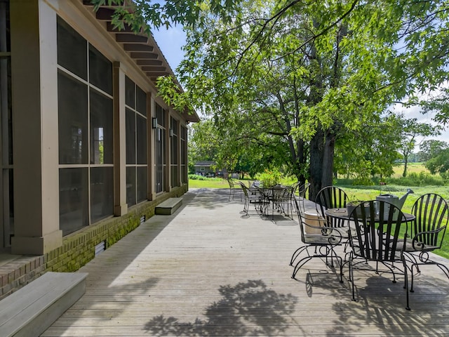 123 Jones Rd, Taft, TN 38488 - wooden deck featuring outdoor dining area