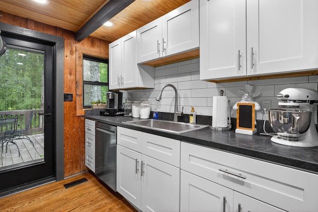123 Jones Rd, Taft, TN 38488 - kitchen with dishwasher, tasteful backsplash, white cabinetry, light wood-style floors, and a wooden ceiling with exposed beams