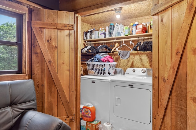 123 Jones Rd, Taft, TN 38488 - laundry room featuring separate washer and dryer and wood walls