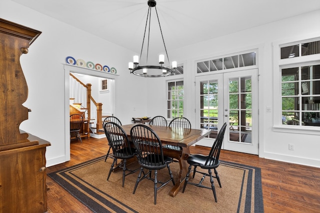123 Jones Rd, Taft, TN 38488 - dining room featuring stairs, wood finished floors, a chandelier, and french doors