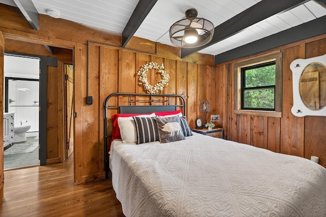 123 Jones Rd, Taft, TN 38488 - bedroom with beam ceiling, wooden walls, hardwood / wood-style flooring, and ensuite bathroom