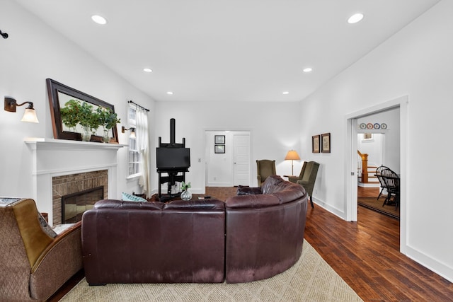 123 Jones Rd, Taft, TN 38488 - living room with dark wood-style floors, recessed lighting, and a glass covered fireplace