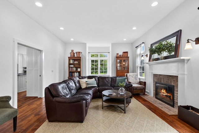 123 Jones Rd, Taft, TN 38488 - living room featuring a fireplace with flush hearth, wood finished floors, and recessed lighting