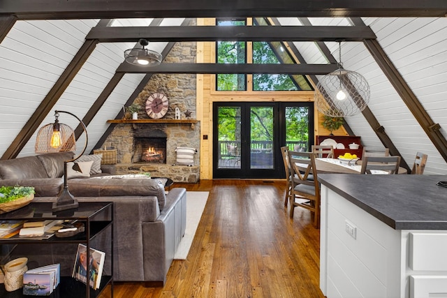 123 Jones Rd, Taft, TN 38488 - living area featuring hardwood / wood-style floors, a stone fireplace, and wood ceiling