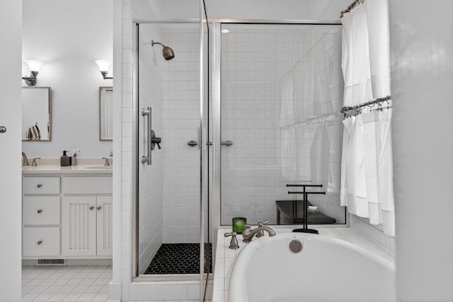 123 Jones Rd, Taft, TN 38488 - bathroom featuring a stall shower, a bath, and vanity