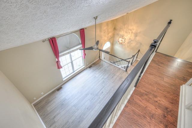 5766 Amalie Dr, Nashville, TN 37211 - stairs featuring a textured ceiling and wood finished floors