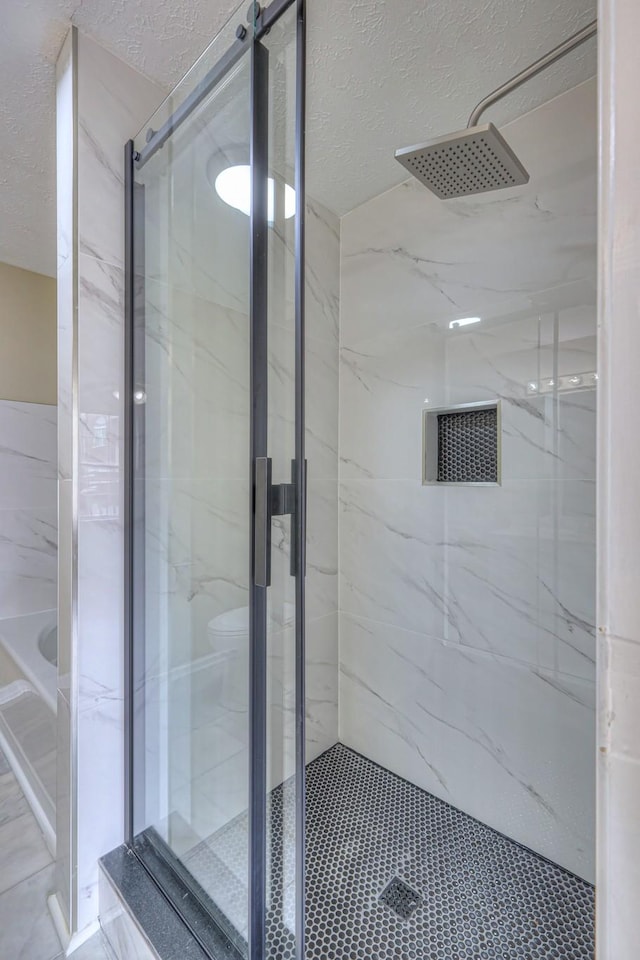 5766 Amalie Dr, Nashville, TN 37211 - full bath featuring a marble finish shower and a textured ceiling
