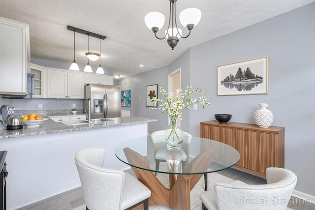 5766 Amalie Dr, Nashville, TN 37211 - dining room with wood finished floors, a chandelier, and recessed lighting