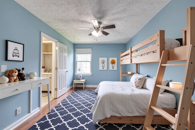 5766 Amalie Dr, Nashville, TN 37211 - bedroom featuring light wood-type flooring, ensuite bathroom, a textured ceiling, and ceiling fan