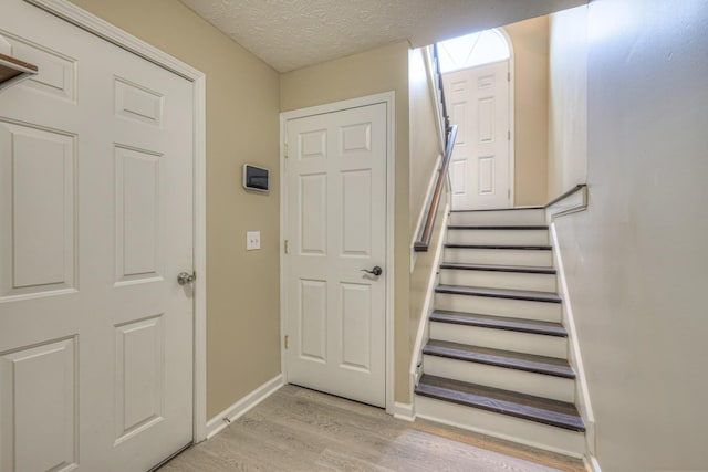 5766 Amalie Dr, Nashville, TN 37211 - stairway with wood finished floors and a textured ceiling
