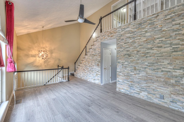 5766 Amalie Dr, Nashville, TN 37211 - spare room featuring wood finished floors, a towering ceiling, ceiling fan, and a chandelier