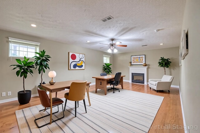 5766 Amalie Dr, Nashville, TN 37211 - home office featuring a textured ceiling, ceiling fan, light wood finished floors, a fireplace, and recessed lighting